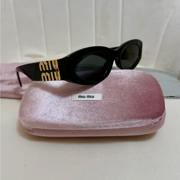 Miu Miu Black Oval Sunglasses with Gold Logo Temples - Picture 1 of 14